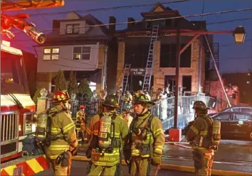  ?? Darrell Sapp/Post-Gazette ?? Pittsburgh firefighte­rs work at the scene of a fire Wednesday at Harris Grill on Ellsworth Avenue in Shadyside.