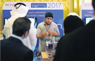  ?? Delores Johnson / The National ?? A student presents a self-operated water supply system that he worked on at the Technical and Vocational Education and Training Innovation Week event yesterday.
