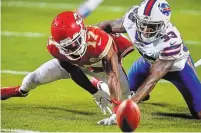  ?? RICH SUGG THE KANSAS CITY STAR FILE PHOTO ?? Mecole Hardman, left, battles with Buffalo Bills safety Siran Neal for a punt the Chief fumbled in the first quarter on Sunday in the AFC Championsh­ip Game at Arrowhead Stadium in Kansas City.