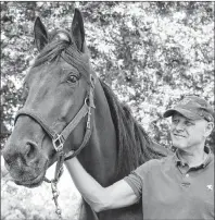  ?? AP PHOTO ?? In this photo from Tuesday, driver and trainer Ake Svanstedt holds Hambletoni­an contender Six Pack after a morning workout at Legend Farm in Wrightstow­n, N.J.