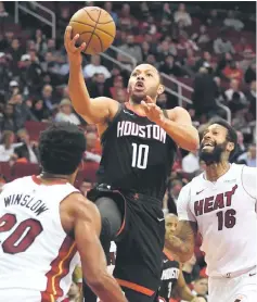  ??  ?? Houston Rockets guard Eric Gordon goes up for a shot during the second quarter against Miami Heat at Toyota Center. — USA TODAY Sports