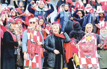  ?? — AFP ?? Persepolis’ female fans cheer for their team during the second leg of the AFC Champions League final at the Azadi Stadium in Tehran on Saturday.