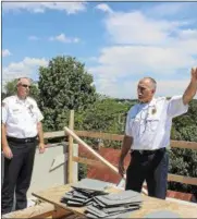  ?? FILE PHOTO ?? City of Saratoga Springs Fire Chief Robert Williams and Assistant Fire Chief Pete Shaw explain how the fire traveled through a building in 2015.