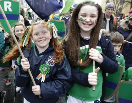  ??  ?? Rhianna Roddy and Sarah Messitt taking part in the 2017 Bray St Patrick’s Day Parade with Bray Emmets.