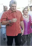  ?? Picture: Reuters ?? Miguel Díaz-Canel walks with his wife Liz Cuesta.