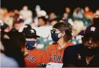  ?? Karen Warren / Staff photograph­er ?? With capacity limited to 50 percent, nearly 21,700 fans were in the stands for the Astros’ home opener on Thursday night.