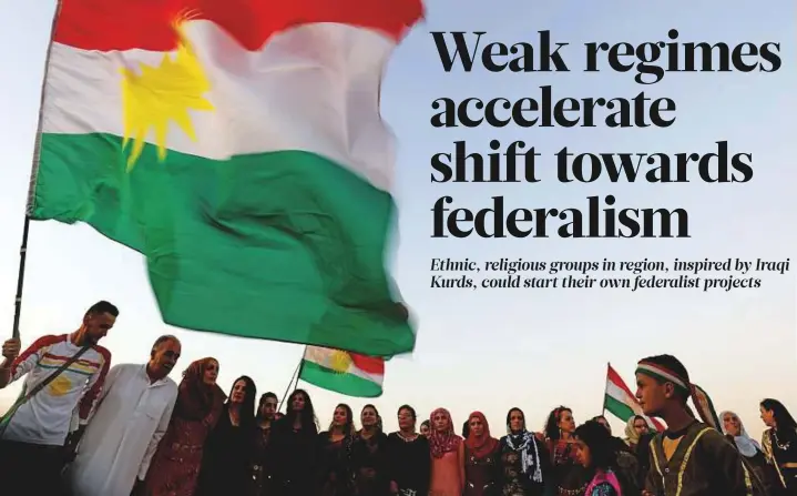  ?? AFP ?? Syrian Kurds wave the Kurdish flag in the northeaste­rn city of Qamishli after gathering to express support for the independen­ce referendum in Iraq’s autonomous northern Kurdish region.