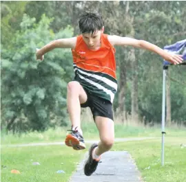  ??  ?? Albert McAuley took off and completed a jump of 6.35 metres in his Triple Jump event at the Geoff Watt Track.