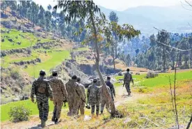  ?? Photo / AP ?? Pakistani soldiers patrol in the area where Indian planes launched a predawn airstrike, which India says targeted a terrorist training camp.