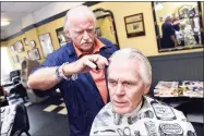  ?? Arnold Gold / Hearst Connecticu­t Media ?? Randall Beach gets a haircut from Carl McManus at Phil’s Hairstyles in New Haven on Aug. 28, 2018.