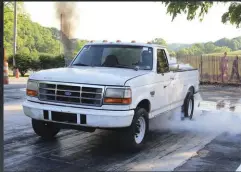  ??  ?? Daniel Klunk lugged his two-wheel drive, 11-second OBS some 700 miles from Pennsylvan­ia to play with all of his 7.3L friends. His F-250 would also take a wild ride down the dirt drag track and even hook to the sled.