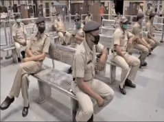  ?? KOLKATA
-AFP ?? Railway police personnel maintain safe distance as they wait to donate blood at a camp during spread of COVID-19.