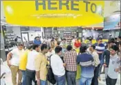  ?? HT/FILE ?? People stand in a queue to buy Jio SIM cards inside a Reliance Digital Express store in east Delhi