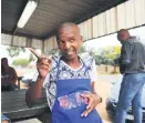  ?? Picture: Michel Bega ?? CHANGES. Kevin Khambule is seen outside his shop Kevin’s Kitchen in Soweto.