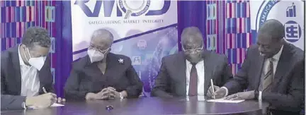  ?? ?? Executives from the Ghana Stock Exchange (GSE) and Jamaica Stock Exchange (JSE) sign an MOU on May 2 to solidify partnershi­ps across markets. From left: Julian Mair, JSE chairman; Marlene Street Forrest, managing director of the JSE; Peterson Ekow Afedzie, managing director of the GSE; and Rev Dr Daniel Ogbarmey-tetteh, director general, Securities and Exchange Commission (SEC), Ghana.