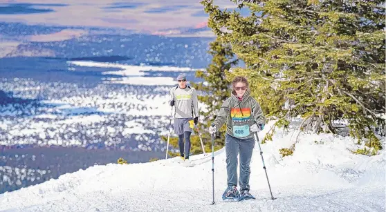  ?? COURTESY OF LOBO PHOTO NM ?? Participan­ts in the Mt. Taylor Winter Quadrathlo­n snowshoe through a stretch of the event.