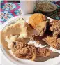  ?? [PHOTO BY DEBRA BRUNO, FOR THE WASHINGTON POST] ?? Mel’s Cafe in Charlottes­ville, Virginia, offers a fried chicken platter with mashed potatoes, a roll and gravy.