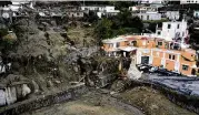  ?? SALVATORE LAPORTA / AP ?? An aerial view of damaged houses after heavy rain triggered landslides that killed seven and left five people missing on the Italian island of Ischia.