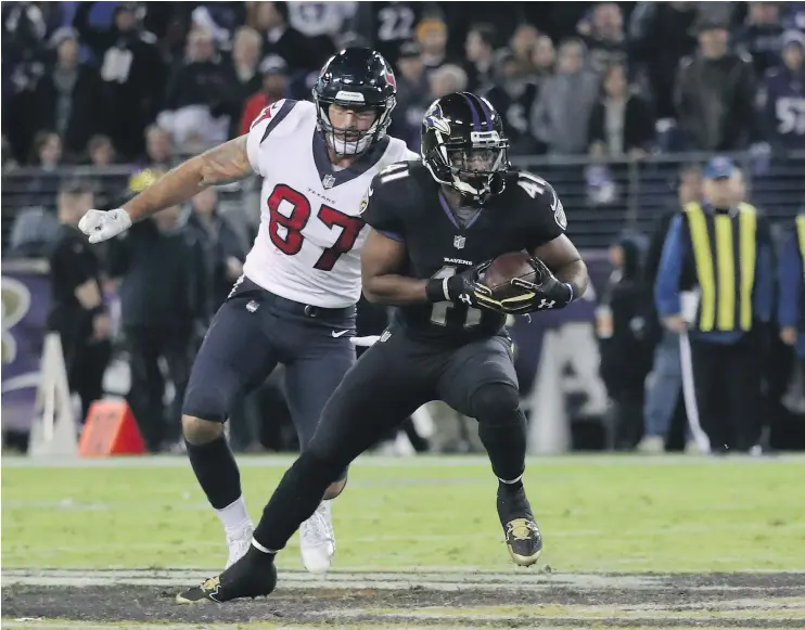  ?? — GETTY IMAGES ?? Baltimore Ravens cornerback Anthony Levine returns an intercepti­on during the fourth quarter against the Houston Texans on Monday night in Baltimore.