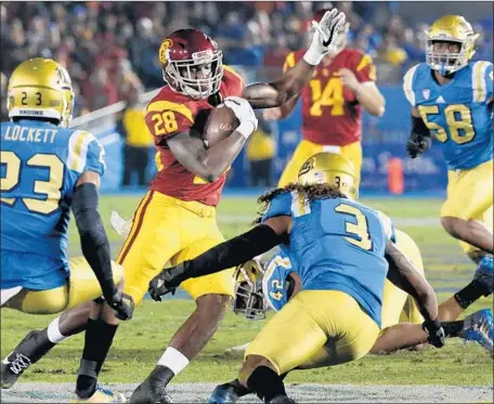  ?? Luis Sinco Los Angeles Times ?? USC’S Aca’Cedric Ware cuts back during the Trojans’ victory over UCLA in 2016. Ware rushed for 23 yards in a backup tailback role.