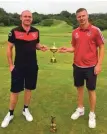  ??  ?? Saints’ captain and competitio­n organiser Dene Cassells presents the Ryder Cup to Camanachd captain Scott MacMillan.