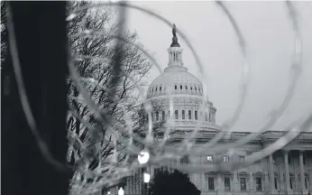  ?? AP ?? The US Capitol fenced with barbed wire before Mr Biden’s inaugurati­on on Wednesday