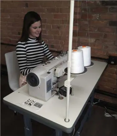  ?? JEAN BONCHAK FOR THE NEWS-HERALD ?? Anne Skoch works on an accessory piece featured in her business, Anne Cate, while at her studio in the Matchworks Building in Mentor.