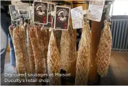  ?? ?? Dry cured sausages at Maison Duculty’s retail shop