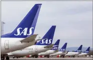  ?? OLE BERG-RUSTEN — NTB SCANPIX VIA AP, FILE ?? SAS planes grounded at Oslo Gardermoen airport during pilots strikes in 2019. SAS has filed for bankruptcy in the United States, warning the announceme­nt of a strike by 1,000 pilots a day earlier had put the future of the carrier at risk, which added to the travel chaos across Europe as the summer vacation period begins.