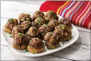  ?? FAMILY FEATURES ?? Beef and Blue Cheese-Stuffed Mushrooms.