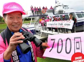 ??  ?? JUST A NUMBER Masami Yabuta ever so slightly celebrates his 700th marathon and ( below) crossing the finish line