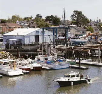  ?? LAURA MORTON ?? A fishing boat goes through the Santa Cruz Small Craft Harbor. For visitors who want to try fishing themselves, Santa Cruz offers a plethora of sports fishing operators with charter trips.