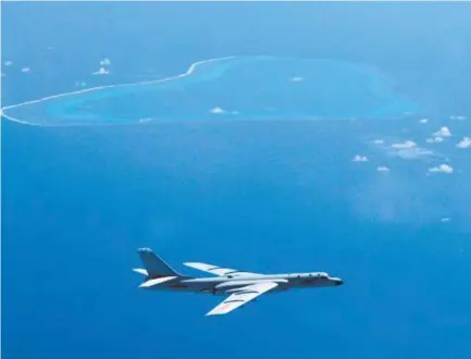  ?? Liu Rui, Xinhua ?? A Chinese H-6K bomber patrols the islands and reefs in the South China Sea. A U.S. think tank says recent images appear to show that China has installed anti-aircraft and anti-missile weapons on its man-made islands.