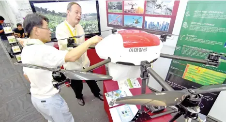  ??  ?? This agricultur­al drone shown in the picture has a 25-kg capacity and can be used to spray pesticide, fungicide, herbicide, or nutrients over crops and can last about 30 minutes in the air before the contents needed to be refilled and the batteries be...