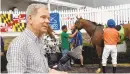  ?? BARBARA HADDOCK TAYLOR/BALTIMORE SUN ?? Jim McCue is the track photograph­er at Laurel Park and Pimlico. He is working in the Winner's Circle at Laurel Park.