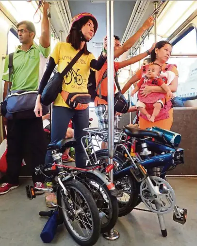  ?? — ANDREW SIA/The Star ?? It’s easy to take your folded bike onto the LRT.