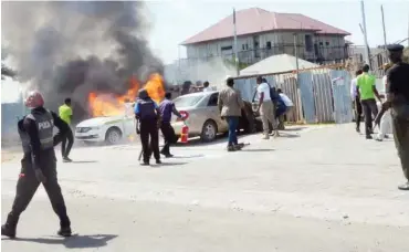  ??  ?? A police vehicle set on fire during a clash between members of the Islamic Movement in Nigeria and the police at Maitama in Abuja