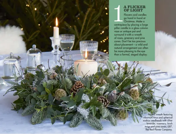  ??  ?? Nordic wreath featuring viburnum tinus and spherical scabius seedheads with silver lavender, rosemary, birch twigs and pine cones, £87, The Real Flower Company.