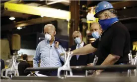  ?? Photograph: Matt Slocum/AP ?? Joe Biden visits a metal fabricatin­g facility in Dunmore, Pennsylvan­ia. The presumptiv­e Democratic nominee believes that building the infrastruc­ture for renewable energy will bring jobs.