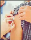  ??  ?? At-risk people are being urged to get vaccinated against the flu virus this winter.