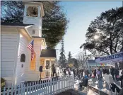  ?? SHMUEL THALER — SANTA CRUZ SENTINEL ?? A mask-wearing crowd gathers in front of the historic Wee Kirk Church in Ben Lomond to celebrate the opening of the Santa Cruz Community Health clinic on Monday.