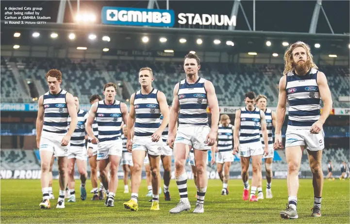  ?? Picture: GETTY ?? A dejected Cats group after being rolled by Carlton at GMHBA Stadium in Round 3.