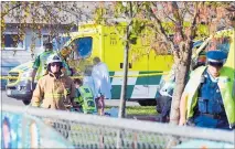  ?? PHOTO / WAIRARAPA TIMES AGE ?? Police and ambulance staff at South End School in Carterton. Students have fallen sick in a mysterious incident.