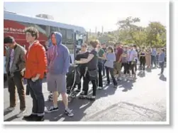  ??  ?? People wait in line to give blood for shooting victims Thursday.