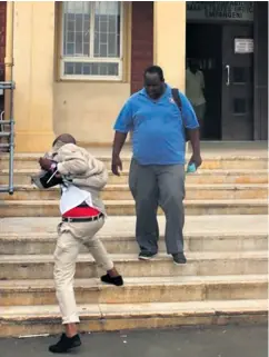  ??  ?? Bongani Magubane was photograph­ed hiding his face at the Empangeni Magistrate’s Court following his arrest in March this year Orrin Singh