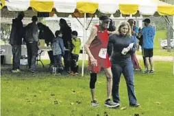  ?? BY HEIDI MAEYER ?? 82 year-old Robert Gurtler of The Plains finishes a soggy Fodderstac­k 10k.