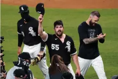  ?? DAVID BANKS/ASSOCIATED PRESS ?? White Sox pitcher Carlos Rodon (55) celebrates with teammates after his no-hit game against the Cleveland Indians on Wednesday night in Chicago. The Sox won, 8-0.