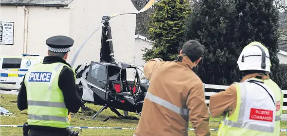  ??  ?? Fire crews, police and other personnel deal with the crash, which took place at Perth Airport.