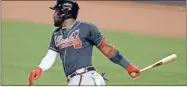  ?? AP-Lynne Sladky, File ?? Atlanta’s Marcell Ozuna watches his single against Miami.