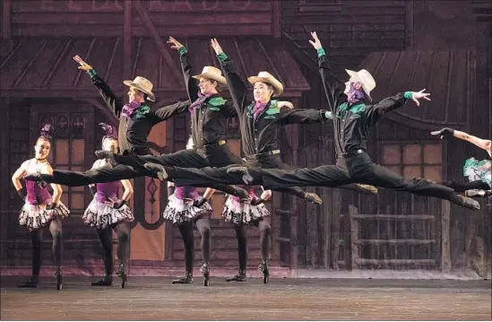  ?? Photograph­s by Reed Hutchinson ?? “COWBOYS” Joshua Brown, left, Magnus Christoffe­rsen, Jeongkon Kim and Clay Murray get folksy in an L.A. Ballet performanc­e of the classic “Western Symphony.”